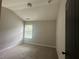 Bedroom with light-colored walls, carpeted floors and a window at 443 Strawberry Walk, Loganville, GA 30052