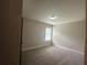 Neutral bedroom with carpet and a window with blinds at 443 Strawberry Walk, Loganville, GA 30052