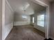 Elegant dining room featuring stylish chandelier and wainscoting at 443 Strawberry Walk, Loganville, GA 30052