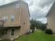 Back exterior view of the home's siding and utilities at 443 Strawberry Walk, Loganville, GA 30052