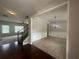 Open-concept living area featuring carpeted floors and a chandelier at 443 Strawberry Walk, Loganville, GA 30052