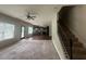 Spacious living room with hardwood floors, fireplace and a door to the outside at 443 Strawberry Walk, Loganville, GA 30052