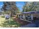 Attractive single-story house with a tidy front yard and a paved driveway leading to a covered carport at 705 Stewart Nw Cir, Marietta, GA 30064