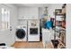 Clean laundry room with white cabinets and modern washer and dryer at 705 Stewart Nw Cir, Marietta, GA 30064