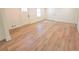 Bright and spacious living room with new, light wood flooring and white trim at 705 Stewart Nw Cir, Marietta, GA 30064