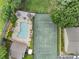 Birds-eye view of a well-maintained pool and tennis court, offering recreational amenities at 1274 Branch Dr, Tucker, GA 30084