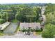 Aerial view of the property, showcasing a swim and tennis court, nestled amongst mature trees at 1274 Branch Dr, Tucker, GA 30084