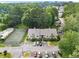 Aerial view showcases a community with a pool, tennis court, and ample parking at 1274 Branch Dr, Tucker, GA 30084