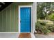 Welcoming entryway with a bright blue door and a 'Stay Awhile' doormat at 1274 Branch Dr, Tucker, GA 30084