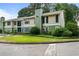 Exterior view of a two story condo with mature landscaping at 1274 Branch Dr, Tucker, GA 30084