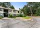 Exterior view of a two story condo with mature landscaping at 1274 Branch Dr, Tucker, GA 30084