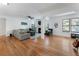 Inviting living room with hardwood floors, a cozy fireplace, and an abundance of natural light at 1274 Branch Dr, Tucker, GA 30084