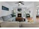 Open-concept living room with a fireplace, comfortable seating, and plenty of natural light at 1274 Branch Dr, Tucker, GA 30084
