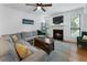 Cozy living room with a fireplace, a comfortable sectional sofa, and stylish decor at 1274 Branch Dr, Tucker, GA 30084