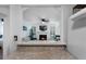 View of living room from breakfast bar, showcasing the fireplace and natural light at 1274 Branch Dr, Tucker, GA 30084