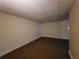 Finished basement area with carpet, neutral walls, and a small window offering natural light and ventilation at 180 Preston Oaks Dr, Johns Creek, GA 30022