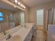 Large bathroom with double sink vanity, tub, separate shower and walk-in closet at 180 Preston Oaks Dr, Johns Creek, GA 30022