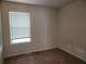 Bedroom with neutral walls, carpet and double hung window at 180 Preston Oaks Dr, Johns Creek, GA 30022