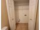 Walk-in closet with wire shelving and access for washer and dryer at 180 Preston Oaks Dr, Johns Creek, GA 30022