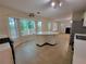 Bright kitchen featuring a center island, access to the backyard, and lots of natural light at 180 Preston Oaks Dr, Johns Creek, GA 30022