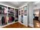 Walk-in closet with custom organizers and views through to the bright main bedroom at 22 The Prado Ne, Atlanta, GA 30309