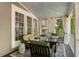 Relaxing covered porch with comfortable seating, privacy curtains, and stylish outdoor decor at 22 The Prado Ne, Atlanta, GA 30309