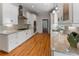 Galley kitchen with stainless steel appliances, white cabinets, and granite countertops at 22 The Prado Ne, Atlanta, GA 30309