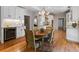 Bright kitchen and dining area featuring stainless steel appliances, and wood floors at 22 The Prado Ne, Atlanta, GA 30309