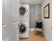 Laundry room features stacked washer and dryer at 22 The Prado Ne, Atlanta, GA 30309