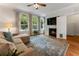 Comfortable living room features a fireplace, large windows, and hardwood floors at 22 The Prado Ne, Atlanta, GA 30309