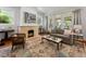 Cozy living room featuring a stone fireplace, neutral color palette, and ample natural light at 22 The Prado Ne, Atlanta, GA 30309