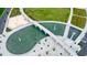 Aerial view showcases park features, including a water feature, green space, and pedestrian bridge at 400 Pringle Dr, Suwanee, GA 30024