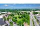 Elevated view of park with mature trees and landscaping around community at 400 Pringle Dr, Suwanee, GA 30024