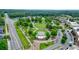 Aerial view of green space and amphitheater amongst parking and surrounding buildings at 400 Pringle Dr, Suwanee, GA 30024