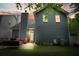 Back exterior view features a patio and fenced-in yard during sunset at 400 Pringle Dr, Suwanee, GA 30024