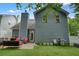 Back exterior view features a patio and fenced-in yard at 400 Pringle Dr, Suwanee, GA 30024