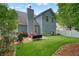 Backyard view featuring green turf, a grill, and views of the fence at 400 Pringle Dr, Suwanee, GA 30024