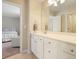 Bathroom vanity with white cabinets, a neutral countertop, and a mirror at 400 Pringle Dr, Suwanee, GA 30024