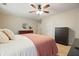 Cozy bedroom with plush carpet, a ceiling fan, and views to other rooms at 400 Pringle Dr, Suwanee, GA 30024