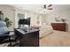 Bright bedroom featuring a ceiling fan, a computer desk, and an area rug at 400 Pringle Dr, Suwanee, GA 30024