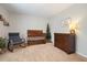 A cozy Bedroom with a crib, rocking chair, and changing table at 400 Pringle Dr, Suwanee, GA 30024