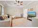 Versatile bonus room features tray ceilings, hardwood floors, and ample space for recreation at 400 Pringle Dr, Suwanee, GA 30024