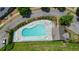 Aerial shot showcasing a pristine community pool with ample seating and landscaped surroundings at 400 Pringle Dr, Suwanee, GA 30024
