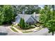 Charming home exterior with manicured landscaping and mature trees at 400 Pringle Dr, Suwanee, GA 30024
