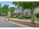 Charming home with blue siding, manicured landscaping, and a welcoming front porch at 400 Pringle Dr, Suwanee, GA 30024
