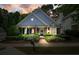 Charming home with blue siding, manicured landscaping, and a welcoming front porch at 400 Pringle Dr, Suwanee, GA 30024