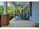 Cozy front porch with comfortable seating, ceiling fans, and stylish blue accents at 400 Pringle Dr, Suwanee, GA 30024