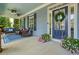 Cozy front porch with comfortable seating, ceiling fans, and stylish blue accents at 400 Pringle Dr, Suwanee, GA 30024
