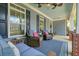 Cozy front porch with comfortable seating, ceiling fans, and stylish blue accents at 400 Pringle Dr, Suwanee, GA 30024