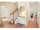 Stylish hallway with hardwood floors, staircase, and elegant decor at 400 Pringle Dr, Suwanee, GA 30024